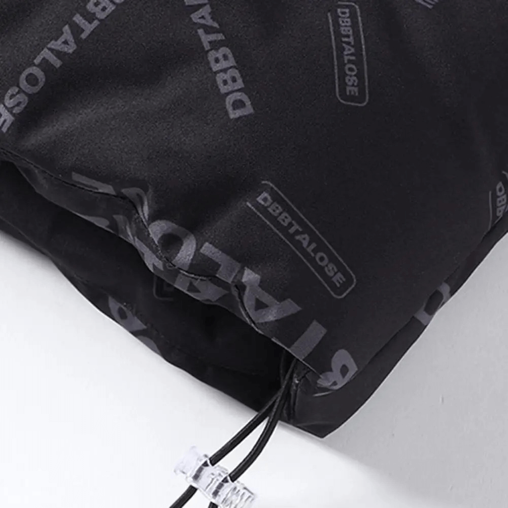 Close-up of men's insulated puffer vest fabric showcasing stitching and DBBTALOSE branding for winter outerwear.